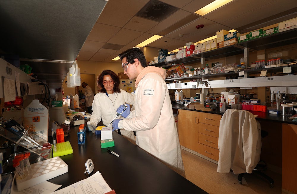 Karine Koch with Anthony in the lab